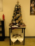 A small Christmas tree covered with steampunk gear ornaments